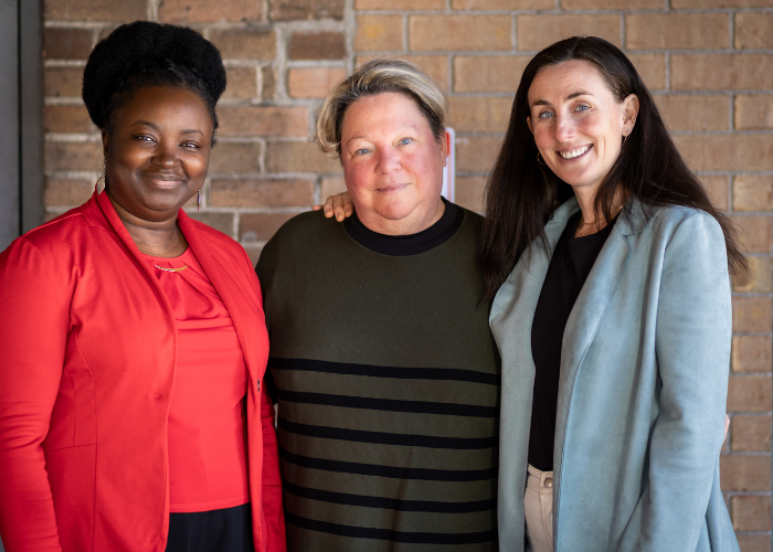 Co-Executive Directors, Marguerite Kinfack (on the left) and Jennifer Brennan (on the right), with Board President, Susan Kessler (in the middle)