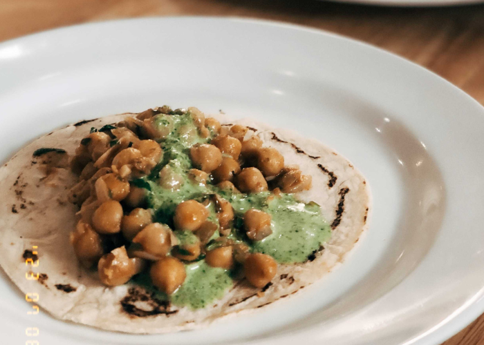 green goddess dressing on tacos with chickpea filling